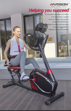 Woman using black and red horizontal exercise bike for home cardio workouts